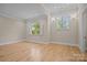 Bright bedroom with hardwood floors and plantation shutters at 3460 Jennings Rd, Union Grove, NC 28689