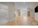 Spacious bonus room with hardwood floors, ensuite bathroom access, and two additional doors at 3460 Jennings Rd, Union Grove, NC 28689