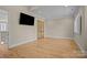 Large bedroom with hardwood floors and access to a hallway at 3460 Jennings Rd, Union Grove, NC 28689