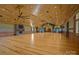 Large common area with wood floors, wood walls, a fireplace and high ceilings at 3460 Jennings Rd, Union Grove, NC 28689