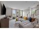 Spacious living room featuring a comfortable sectional sofa and large windows at 12129 Storm Ln # 58, Charlotte, NC 28277