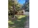 Brick ranch home with front porch and yard at 3238 Campbell Dr, Charlotte, NC 28205