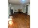 Large room with hardwood floors, suitable for various uses at 3238 Campbell Dr, Charlotte, NC 28205