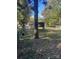 Spacious backyard with tree and chicken coop at 3238 Campbell Dr, Charlotte, NC 28205