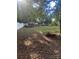 Large backyard with shed, trees, and playset at 3238 Campbell Dr, Charlotte, NC 28205