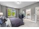 Main bedroom with ensuite bathroom access and large windows at 12118 Storm Ln # 51, Charlotte, NC 28277