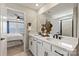 Bathroom with double vanity, and a view of bedroom at 15002 Caspian Way, Charlotte, NC 28278