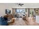 Spacious living room features stylish furniture, large windows, and hardwood floors at 15002 Caspian Way, Charlotte, NC 28278