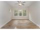 Spacious bedroom featuring hardwood floors and large windows at 9247 Eleanor Dr, Charlotte, NC 28214