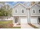 Front view of a gray two-story home with attached garage at 9247 Eleanor Dr, Charlotte, NC 28214