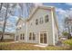 Two-story home with gray siding, multiple windows, and a sliding glass door at 9251 Eleanor Dr, Charlotte, NC 28214