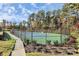 Well-maintained tennis court with surrounding fence at 14920 High Bluff Ct # 101, Charlotte, NC 28278