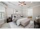 Main bedroom with virtually staged furniture and ensuite bathroom access at 14920 High Bluff Ct # 101, Charlotte, NC 28278