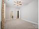 Bedroom with carpet, ceiling fan and access to bathroom at 14920 High Bluff Ct # 101, Charlotte, NC 28278