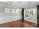 Dining room with coffered ceiling, chandelier, large windows, and wainscoting at 2714 Stonewood Vw, Kannapolis, NC 28081