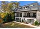 Modern white townhome with a large deck and fenced backyard at 4107 Closeburn Townes Ct, Charlotte, NC 28210