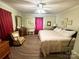 Large bedroom with king-size bed and a ceiling fan at 16409 Silver Rd, Oakboro, NC 28129