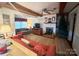 Spacious living room with a fireplace and ample natural light at 16409 Silver Rd, Oakboro, NC 28129