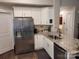 Modern kitchen with white cabinets, granite countertops, and stainless steel appliances at 1025 Old Charlotte Rd, Statesville, NC 28677