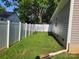 Simple grassy backyard with a white privacy fence at 1025 Old Charlotte Rd, Statesville, NC 28677