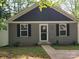 Gray house with gray vinyl siding, white trim and black shutters at 1025 Old Charlotte Rd, Statesville, NC 28677