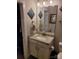 Bathroom with granite vanity, updated fixtures and a large mirror at 1025 Old Charlotte Rd, Statesville, NC 28677