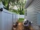Small side yard with a path, chairs and privacy fence at 1025 Old Charlotte Rd, Statesville, NC 28677