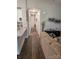 Long hallway with wood-look flooring connecting rooms at 1025 Old Charlotte Rd, Statesville, NC 28677