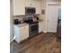 Kitchen with white cabinets, granite countertops, and stainless steel appliances at 1025 Old Charlotte Rd, Statesville, NC 28677