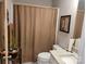 Main bathroom with tub shower and decorative accents at 1025 Old Charlotte Rd, Statesville, NC 28677