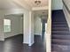 Bright entryway with dark hardwood floors and staircase at 1007 Silverwood Dr, Waxhaw, NC 28173