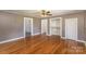 Hardwood floors, neutral walls, and built-in shelving at 127 E Branch Ave, Shelby, NC 28152