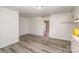 View of kitchen with vinyl flooring and access to another room at 127 E Branch Ave, Shelby, NC 28152