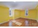 Bright bedroom with hardwood floors and large windows at 127 E Branch Ave, Shelby, NC 28152