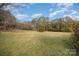 Large open area with grassy field and trees in background at 127 E Branch Ave, Shelby, NC 28152