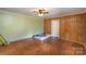 Bedroom with wood paneled walls and ceiling fan at 127 E Branch Ave, Shelby, NC 28152