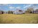 Large backyard with green grass and a view of neighboring homes at 127 E Branch Ave, Shelby, NC 28152