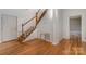 Hardwood floors, white walls, and staircase at 127 E Branch Ave, Shelby, NC 28152