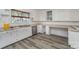 Kitchen with white cabinets and gray flooring at 127 E Branch Ave, Shelby, NC 28152