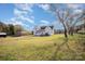 Farmhouse exterior with large backyard and additional building at 127 E Branch Ave, Shelby, NC 28152