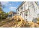 Two-story home with light siding and wooden deck at 153 Emery Nw Ave, Concord, NC 28027