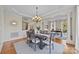 Elegant dining room featuring hardwood floors and a large chandelier at 9440 Wallace Pond Dr, Huntersville, NC 28078