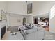 Open living room with a fireplace and view into kitchen at 9440 Wallace Pond Dr, Huntersville, NC 28078