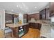 Spacious kitchen with island, stainless steel appliances, and hardwood floors at 9440 Wallace Pond Dr, Huntersville, NC 28078