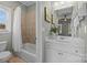 Clean bathroom with a shower/tub combo and vanity at 9440 Wallace Pond Dr, Huntersville, NC 28078