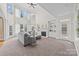 Spacious living room with a fireplace and ample natural light at 9440 Wallace Pond Dr, Huntersville, NC 28078