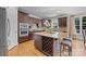 Kitchen boasts granite island with wine rack and stainless steel appliances at 9440 Wallace Pond Dr, Huntersville, NC 28078