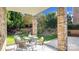 Covered patio with seating area and yard views at 9440 Wallace Pond Dr, Huntersville, NC 28078