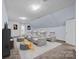 Home theater with reclining seats and large screen at 9440 Wallace Pond Dr, Huntersville, NC 28078