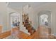 Elegant entryway with hardwood floors and staircase at 9440 Wallace Pond Dr, Huntersville, NC 28078